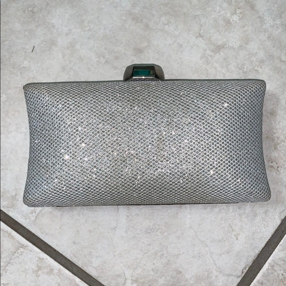 Silver clutch with shoulder chain. Lightly used